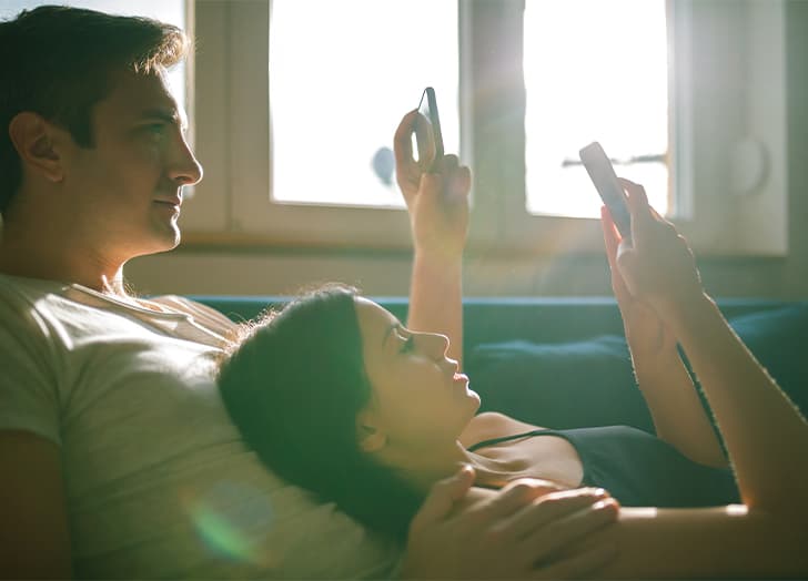 ethical-non-monogamy: couple on their phone
