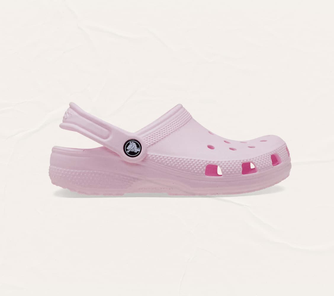 A light pink Croc on a plain background for a story on what podiatrists really think of Crocs