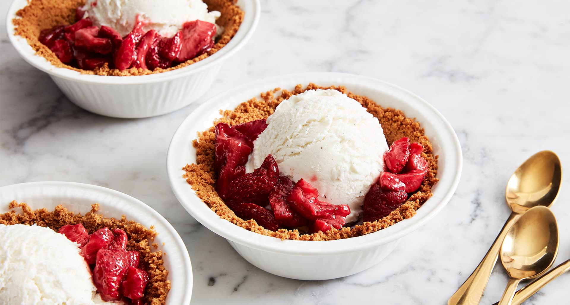 4th of july recipes: strawberry ice cream pie in a bowl on a marble counter
