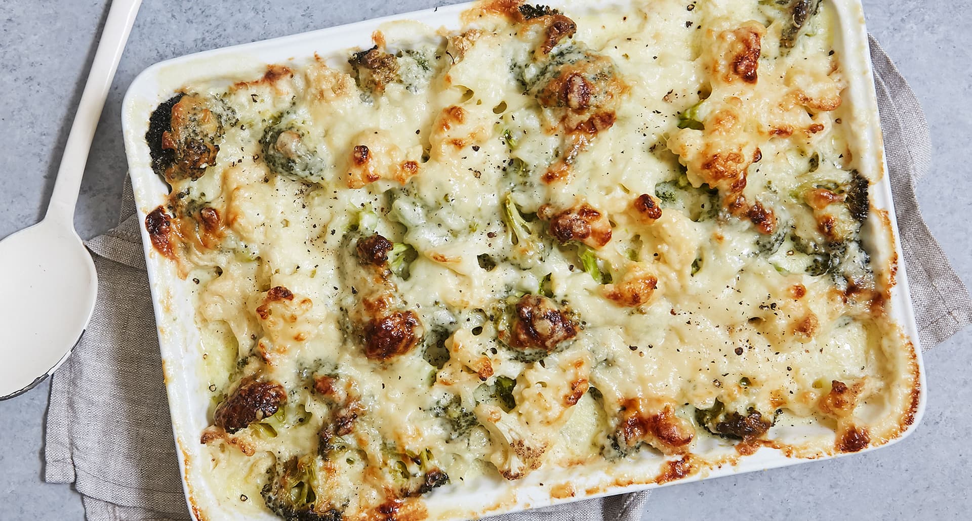 thanksgiving casseroles: baking dish of broccoli and cauliflower gratin