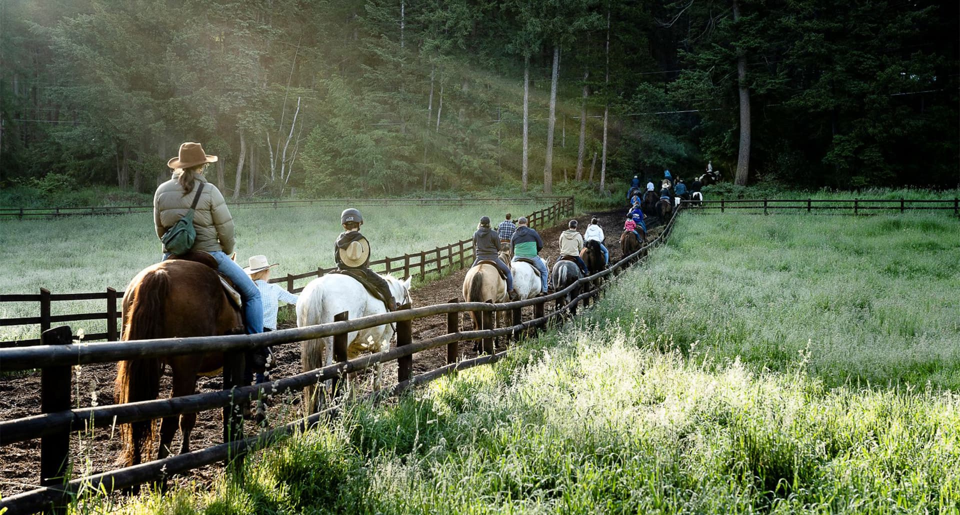 flathead lake lodge review: people riding horses.