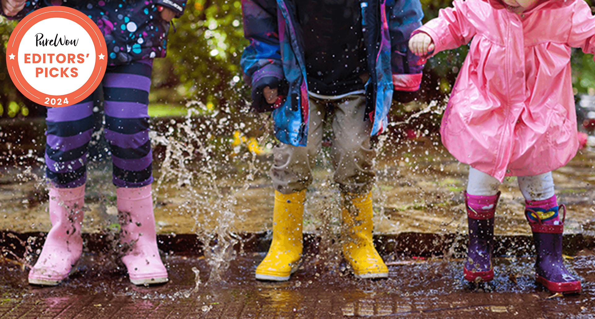 rain boots for kids, vetted by parennts - three kids splash in a puddle