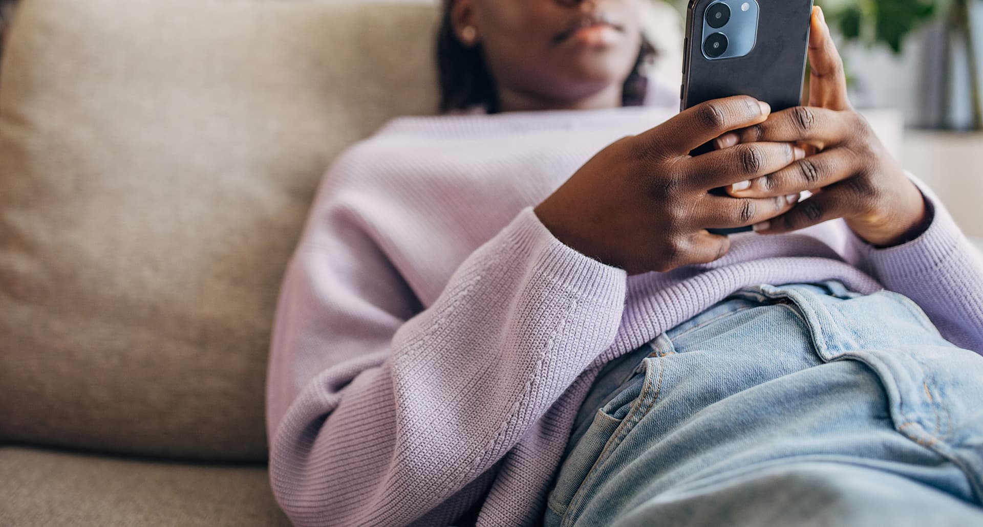 A woman on her couch decides ghosting is the best option