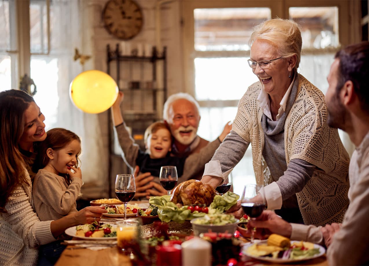thanksgiving-day-activities: A family sitting around the dinner table at Thanksgiving.