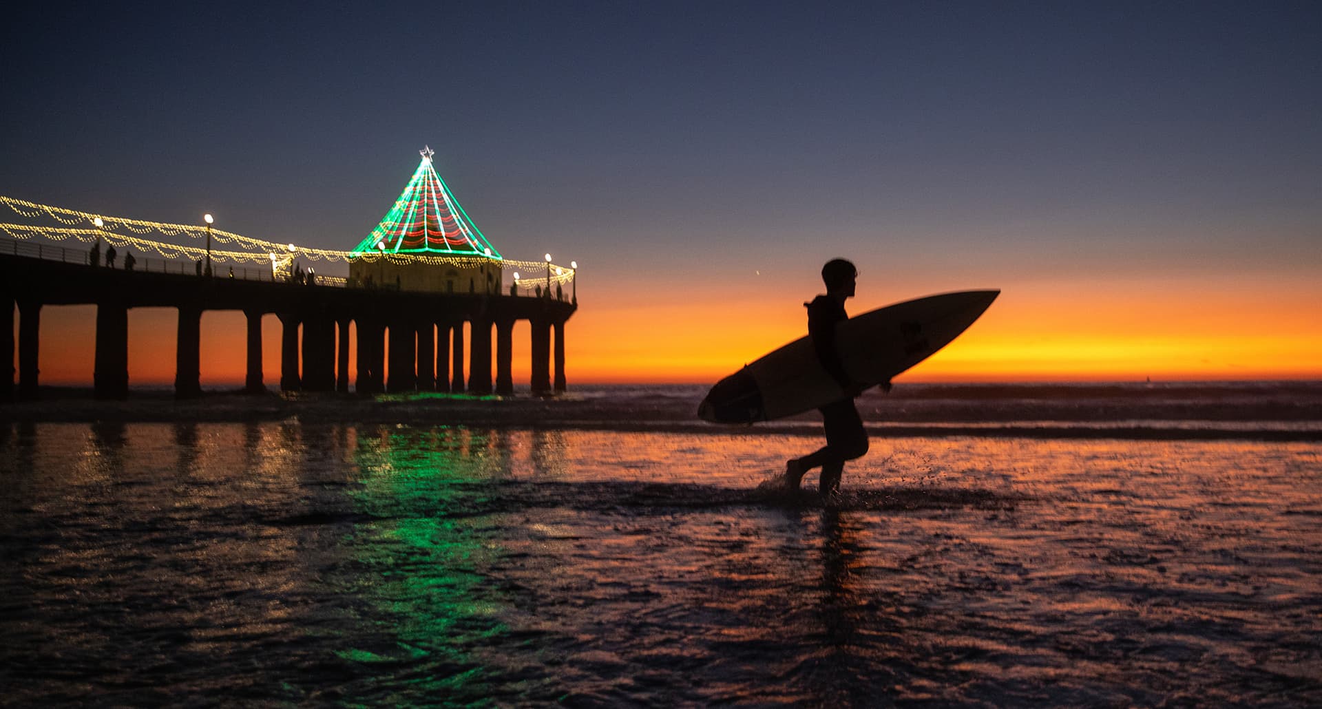 Christmas in LA: Sunset surfer at pier