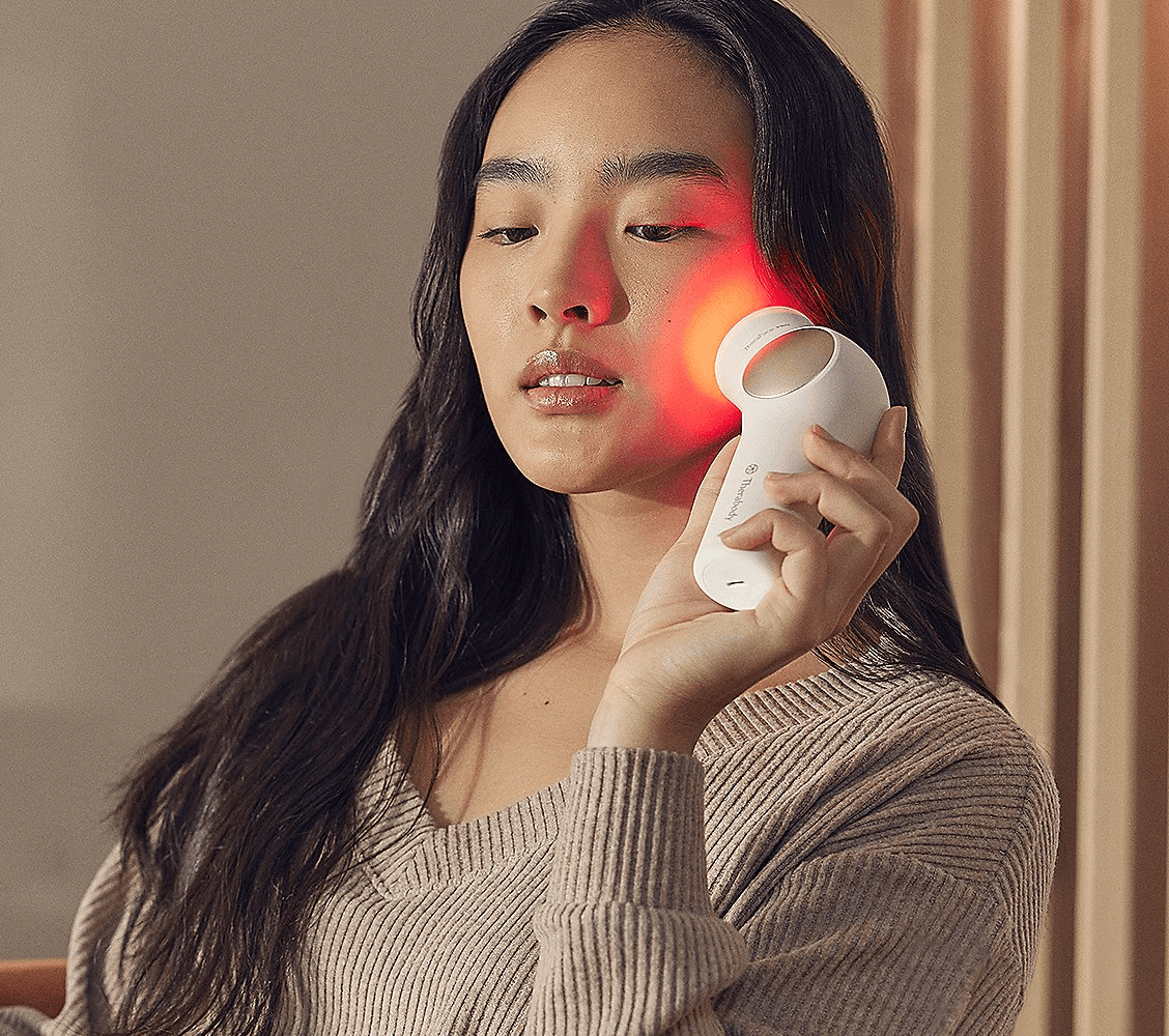 TheraFace Pro QVC Sale: Woman using the TheraFace Pro on her face