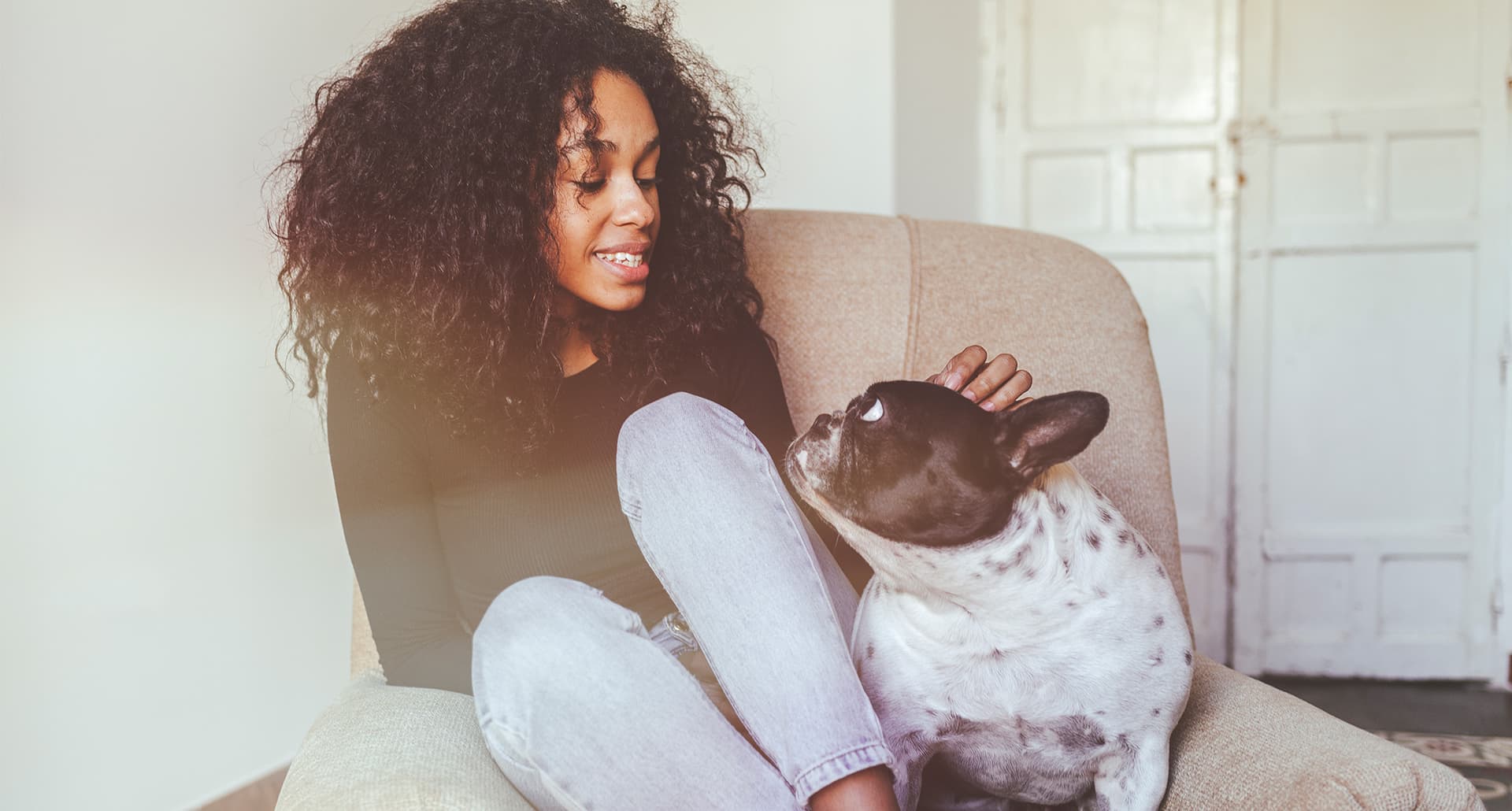 can dogs sense pregnancy? a woman and a dog on the couch