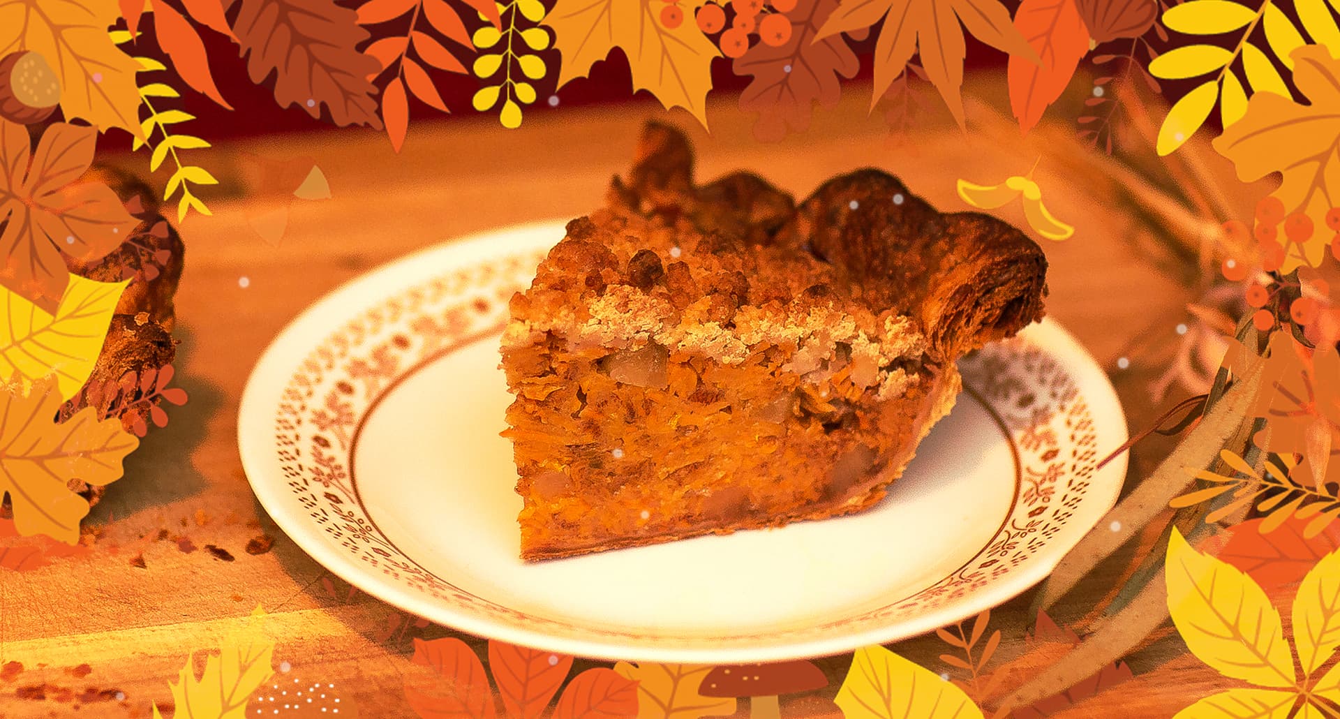 Edith Pie's Persimmon and Ginger Streusel - A warm-toned photograph of a slice of Edith Pie's Persimmon and Ginger Streusel sitting on a white plate. There's an additional piece that is only slightly in frame. There are also some autumnal decorative elements. Everything is positioned on a wooden table. The photo has a border made up of yellow, orange, and red autumnal leaves.