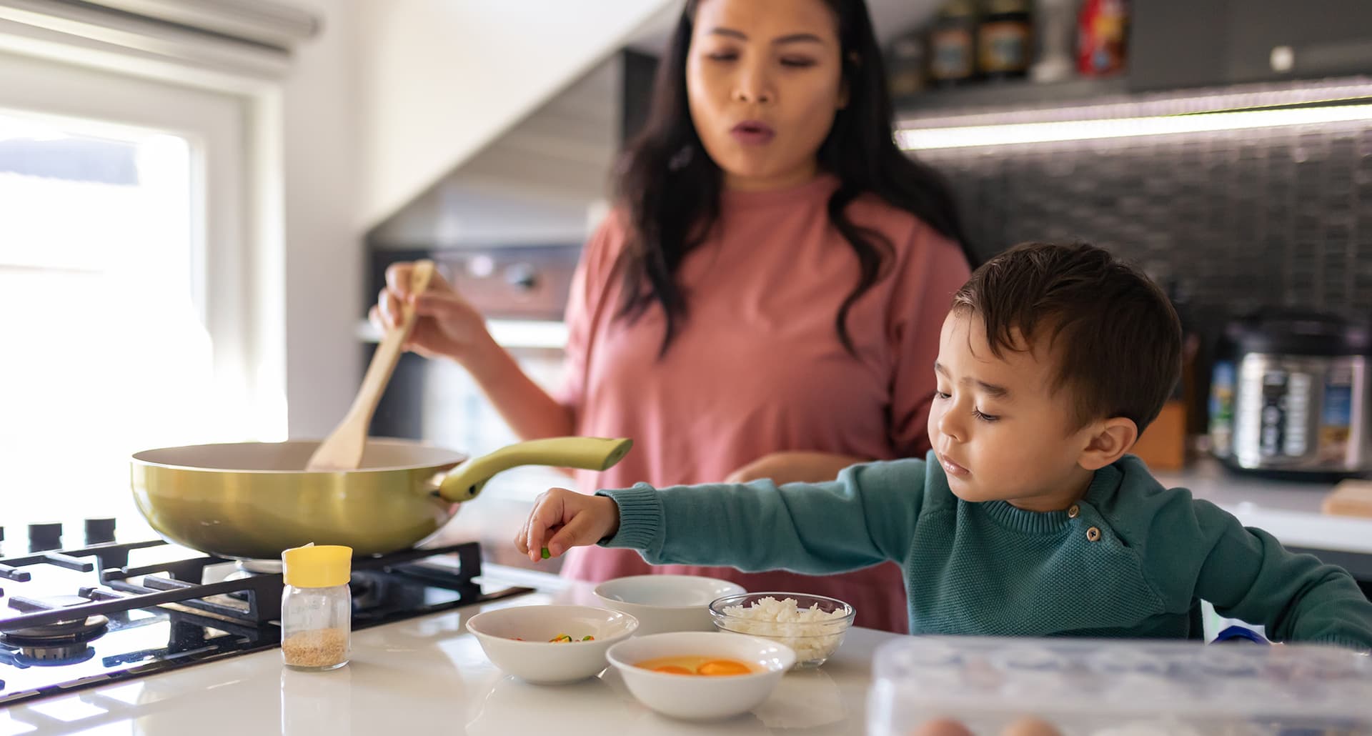 can-gas-stoves-make-kids-sick-pediatrician-advice-mom-son-cooking-eggs