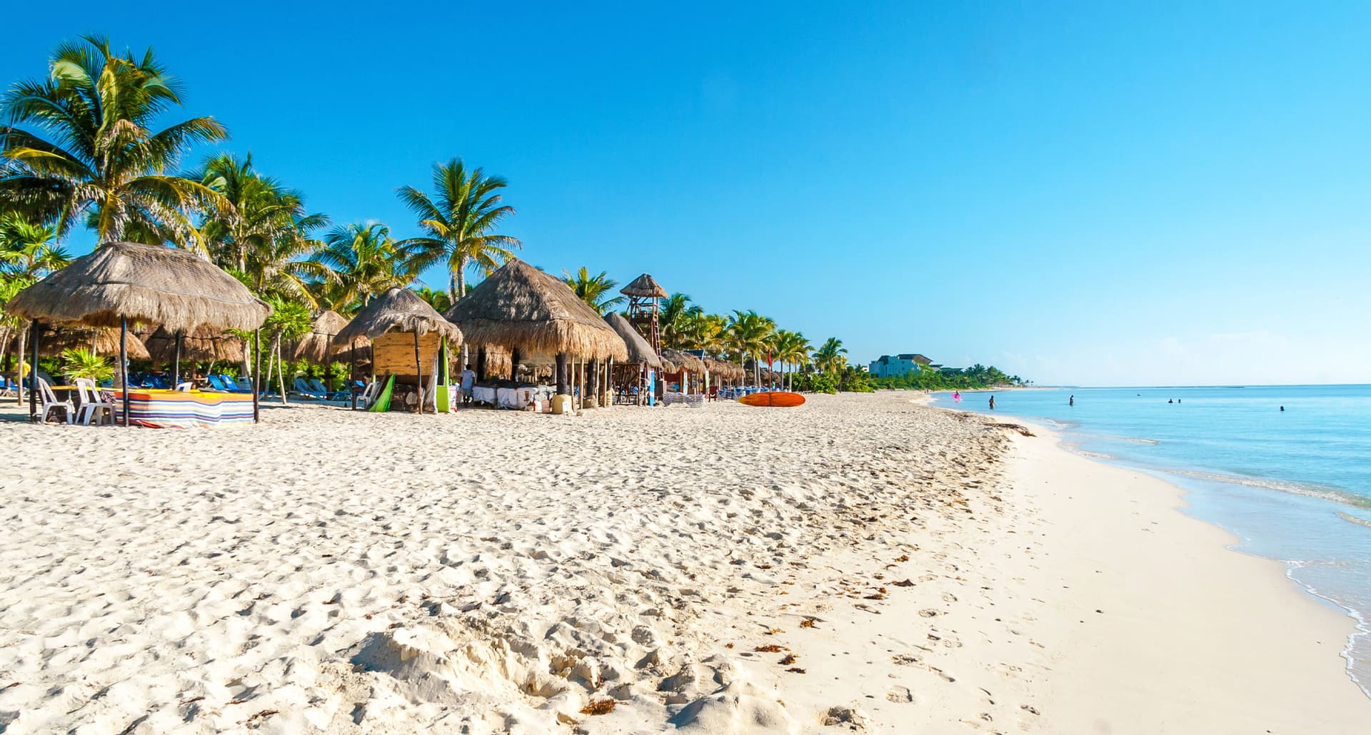 7 Places to Travel to in the Caribbean - Beautiful Caribbean beach at Playa del Carmen with emerald water, Quintana Roo, Mexico.