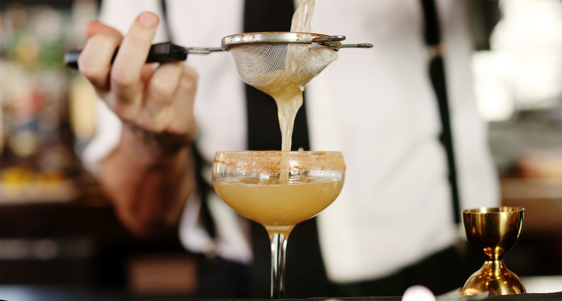 Best Spots for Non Alcoholic Drinks in San Francisco - A bartender pours a freshly made drink into a glass.