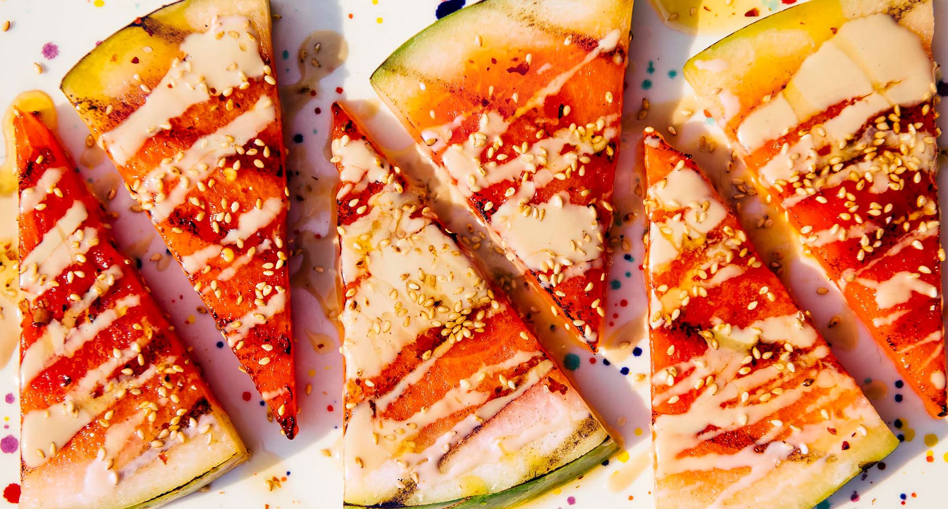 labor day menu recipes: grilled melon with tahini sauce and sesame seeds