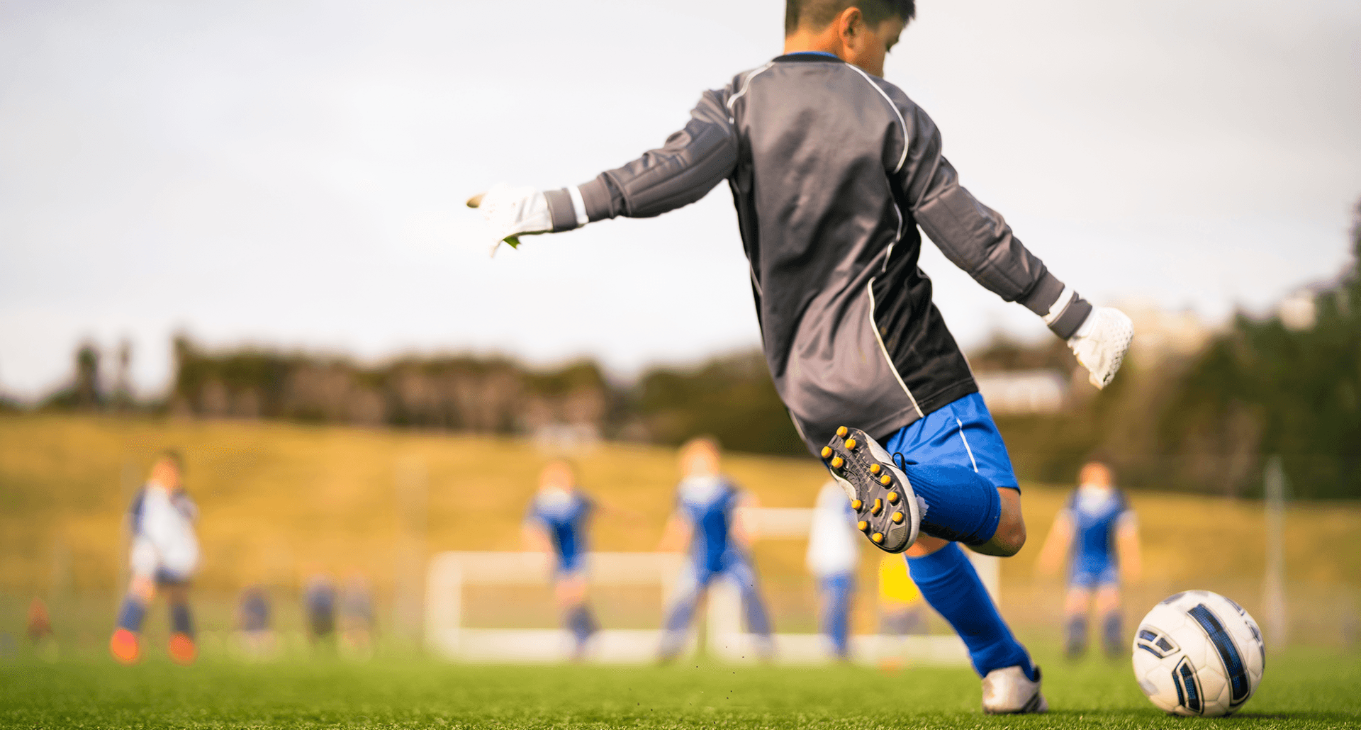 why-are-we-making-7-year-olds-try-out-for-sports-kid-playing-soccer