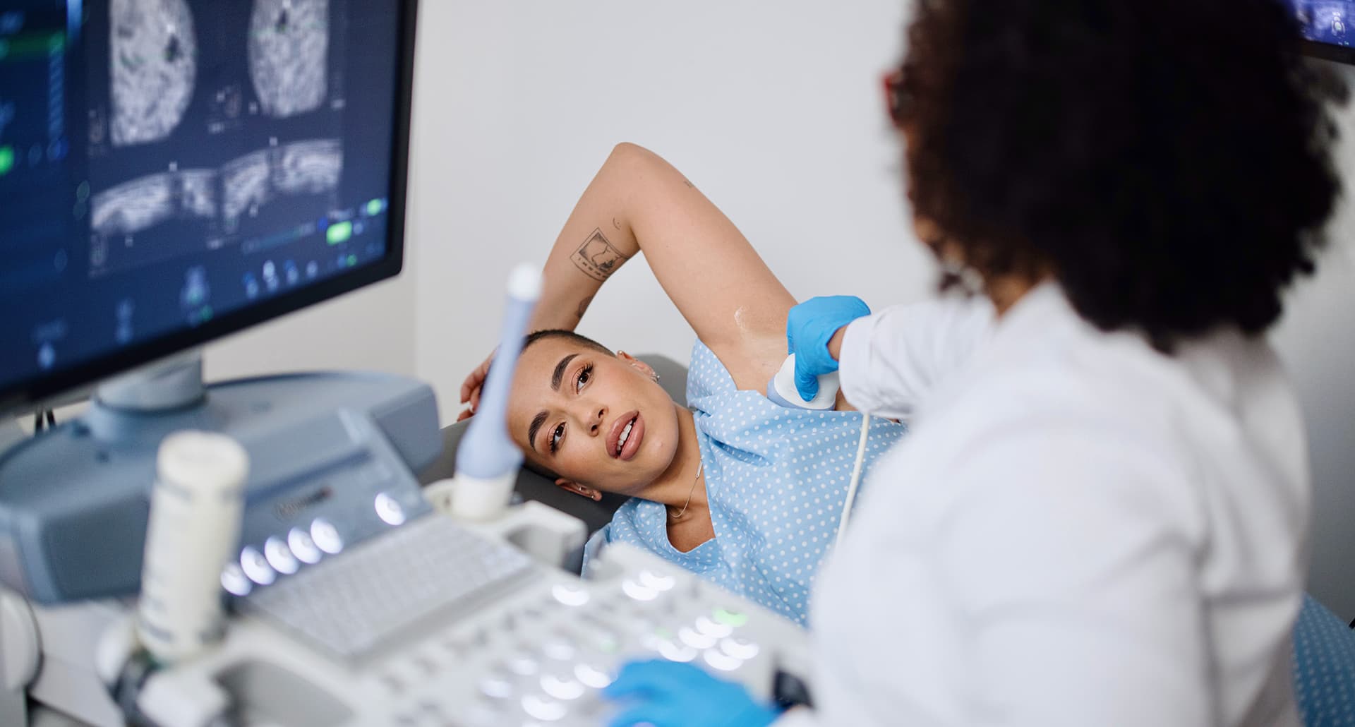 fibroglandular density dense breasts: Woman having ultrasound screening