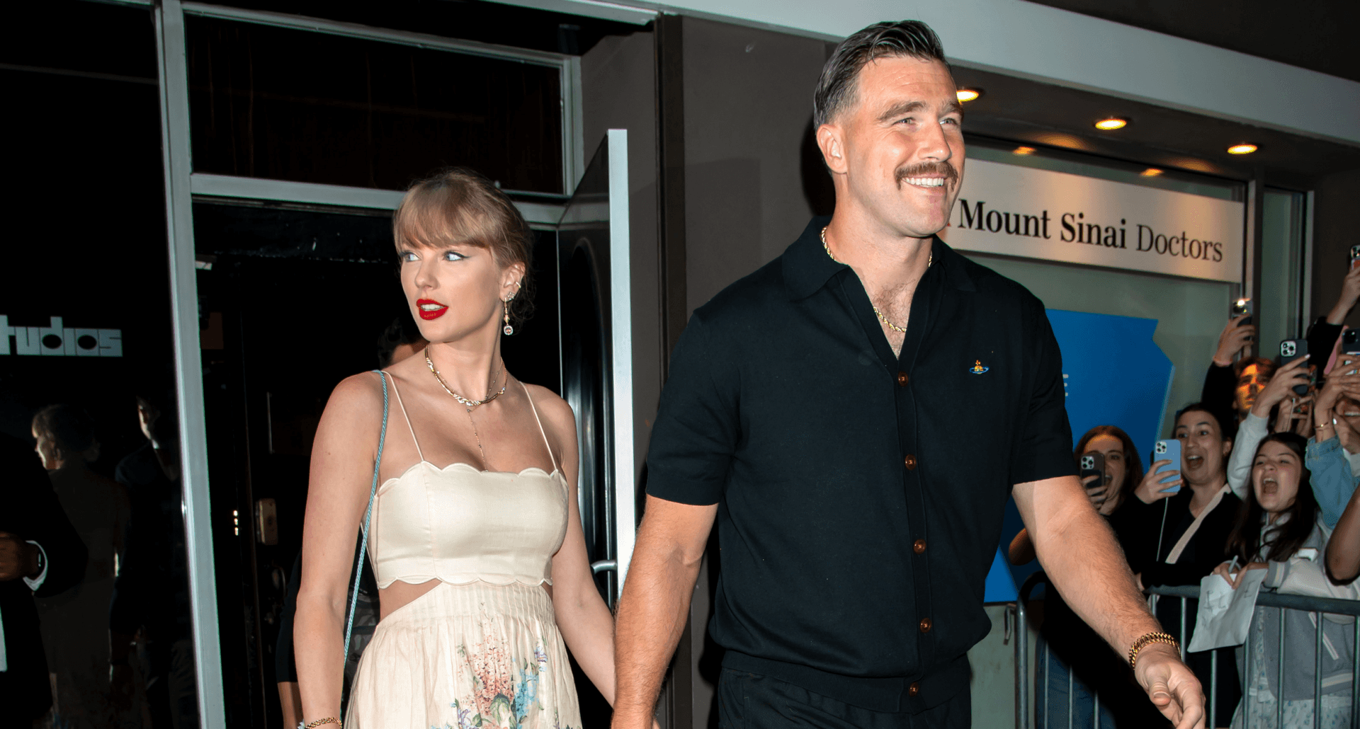 taylor swift and travis kelce walk down street
